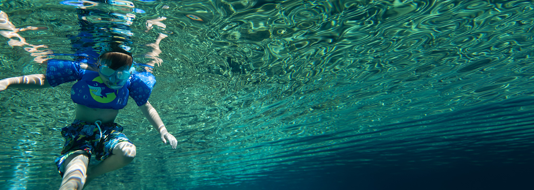 Boy swimming in Head Spring