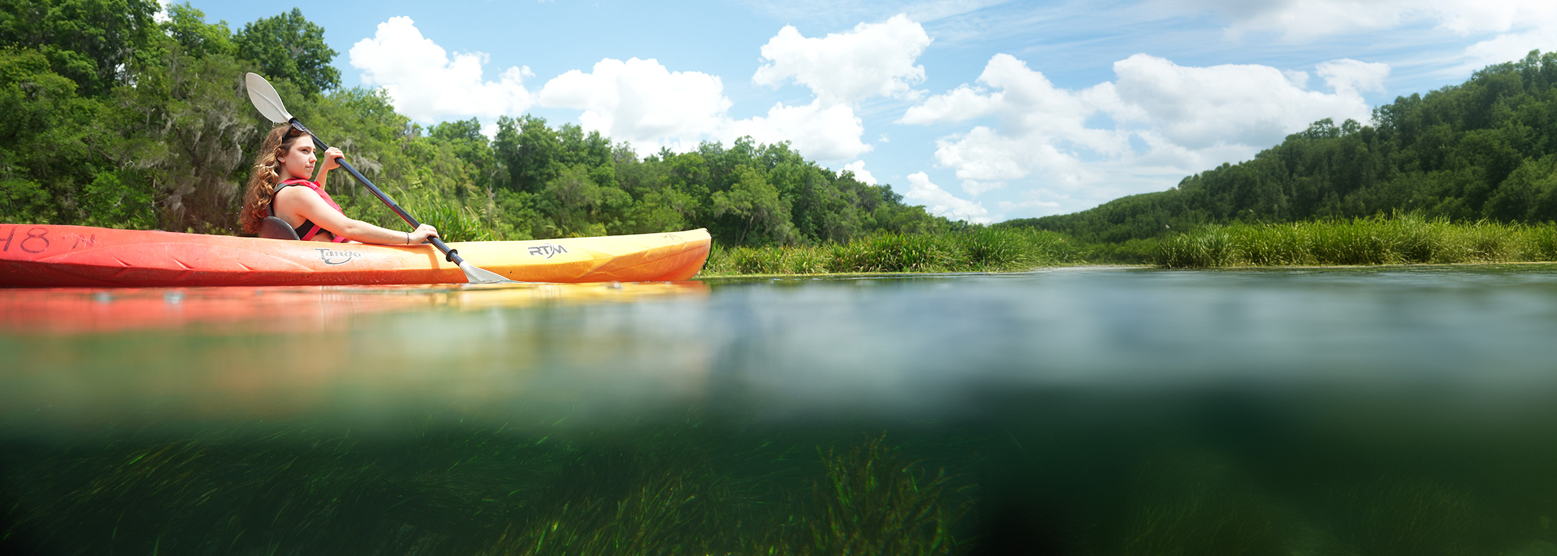 Girl paddling Ichetucknee River