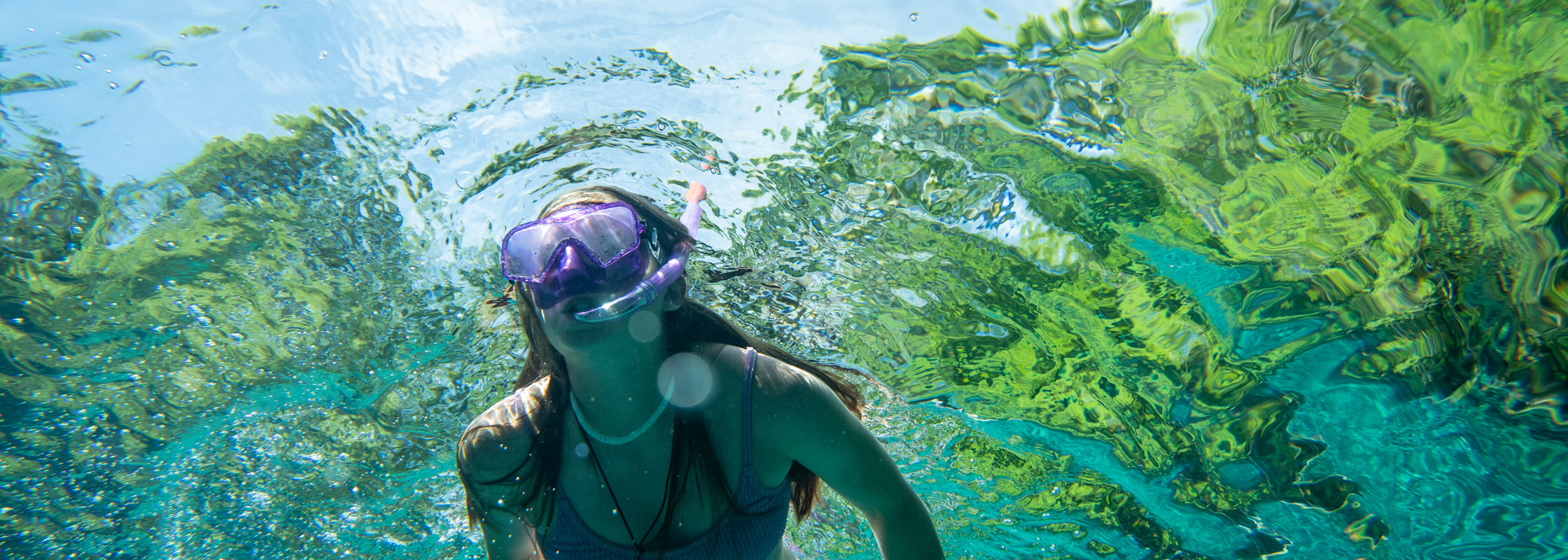 Girl swimming Ichetucknee Head Spring