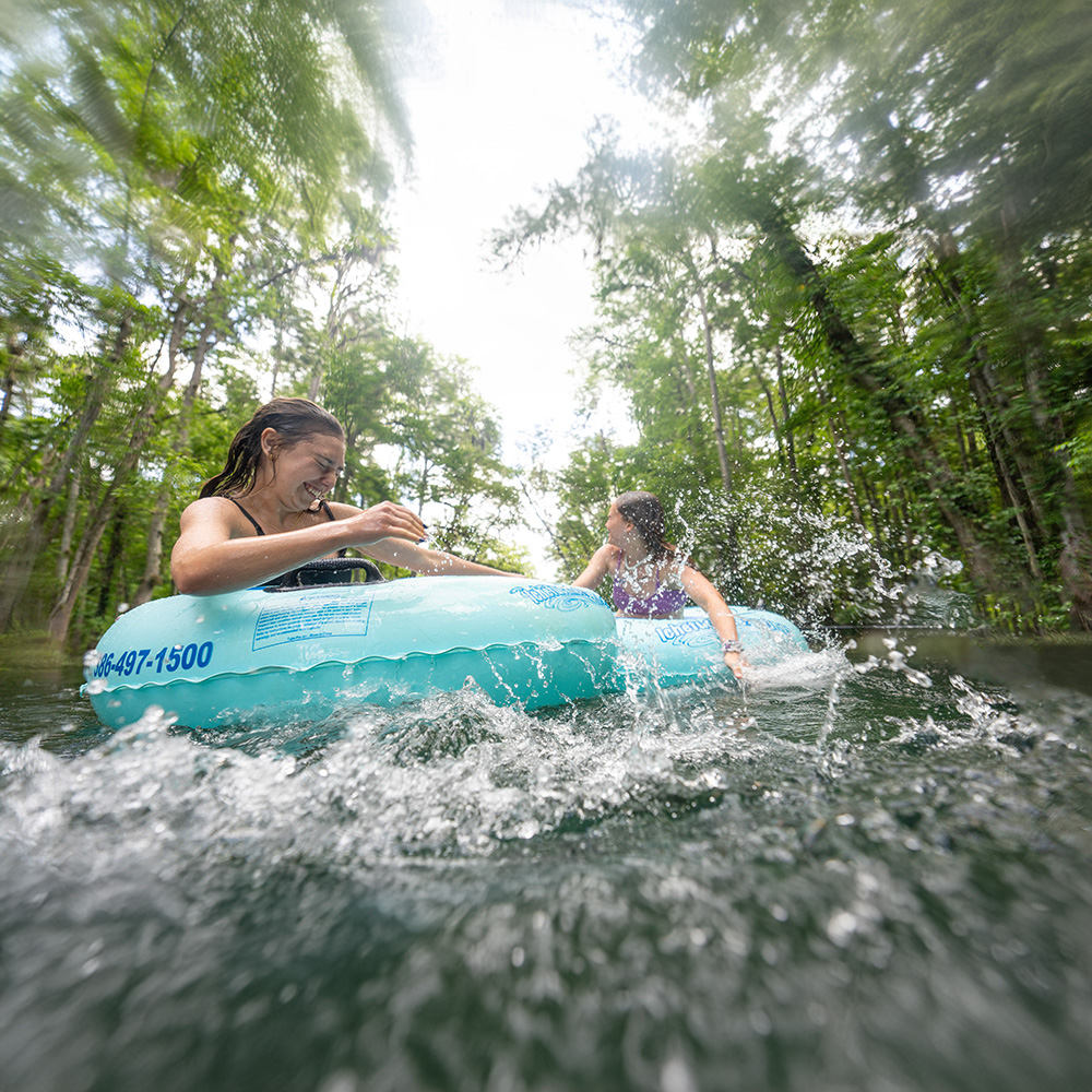 Girls splashing on tubes